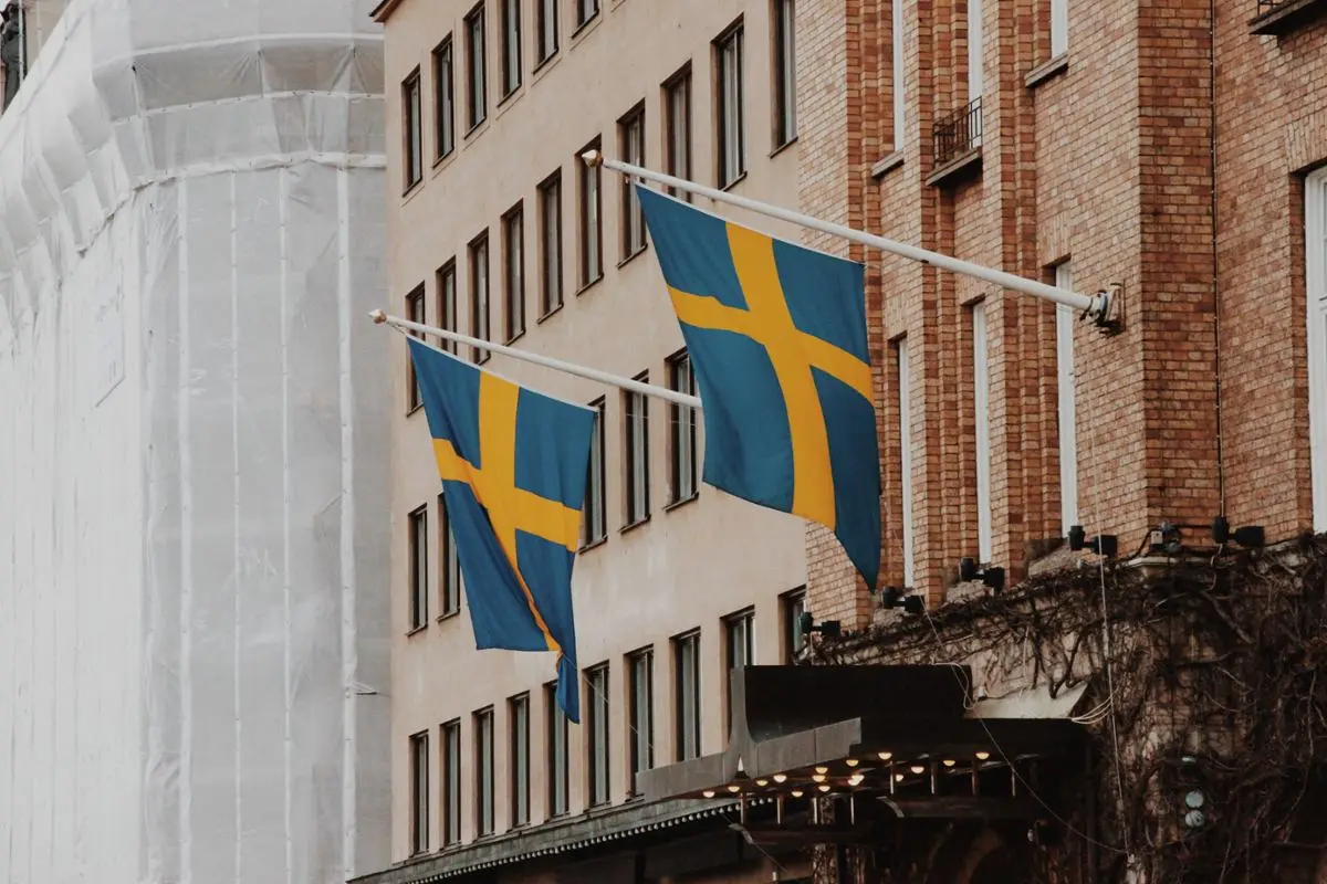 Sweden's national flags on a building.