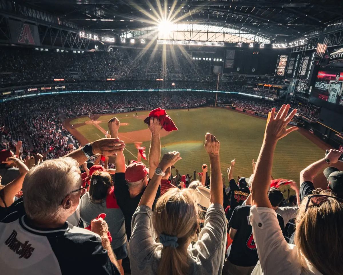 Sports fans cheering.