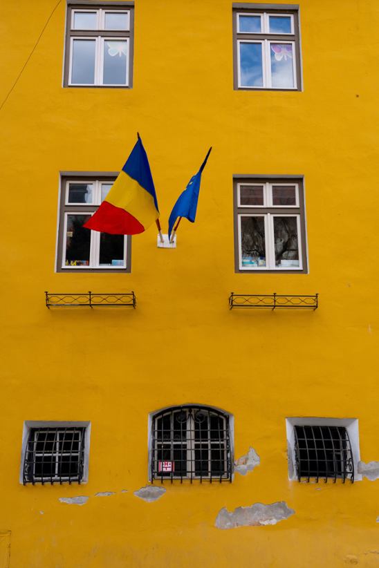 Romania national flag on a wall.