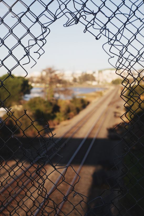 A torn barbed wire fence.