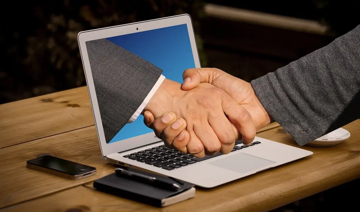 handshake-through-computer-screen