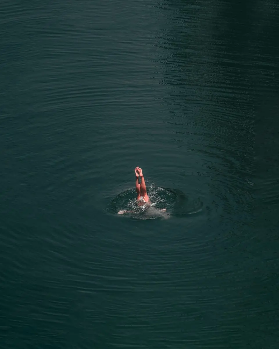 A person diving into water.