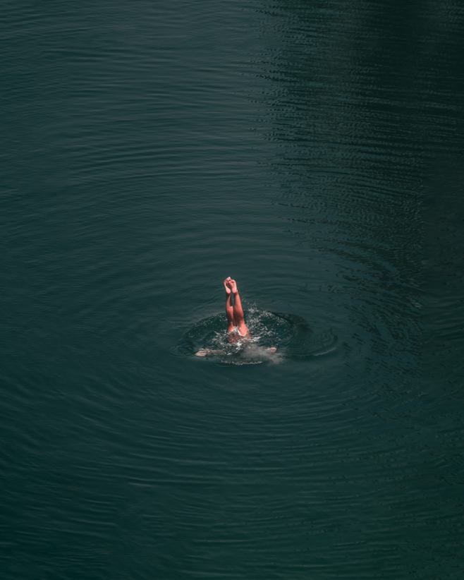 A person diving into water.