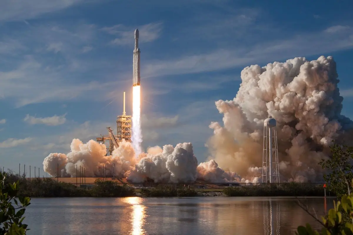 A rocket lauching off to space.