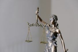 Lady justice holding the scales.