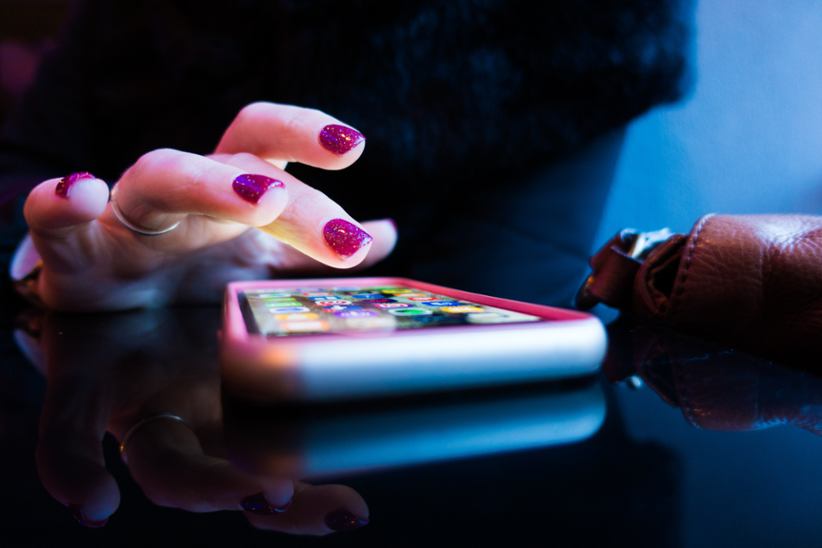 A lady using her mobile phone.