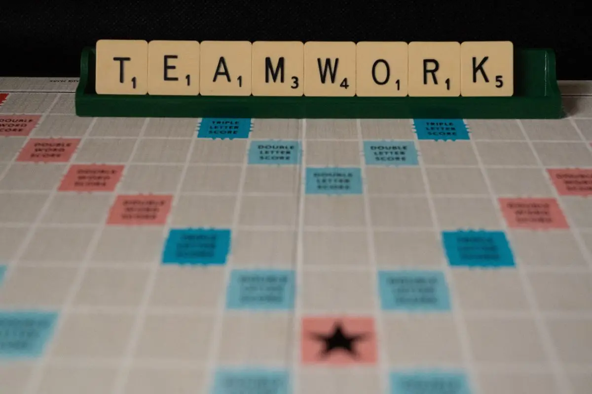 Scrabble spelling teamwork.