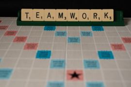 Scrabble spelling teamwork.