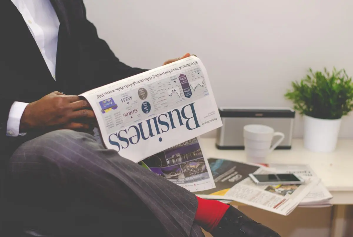 A man reading a newspaper.