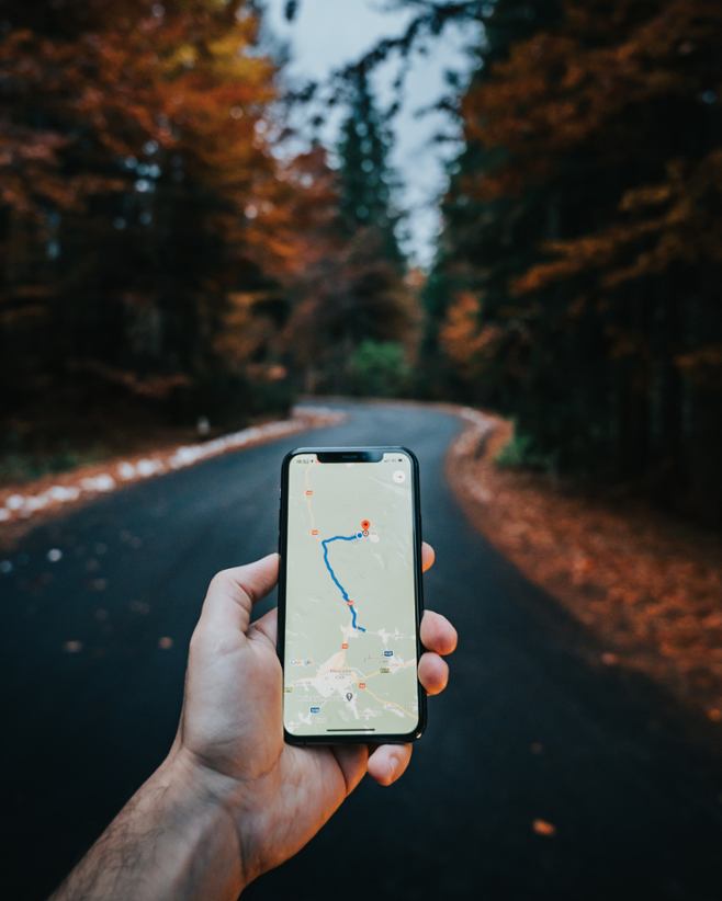 A person holding a phone with a map.