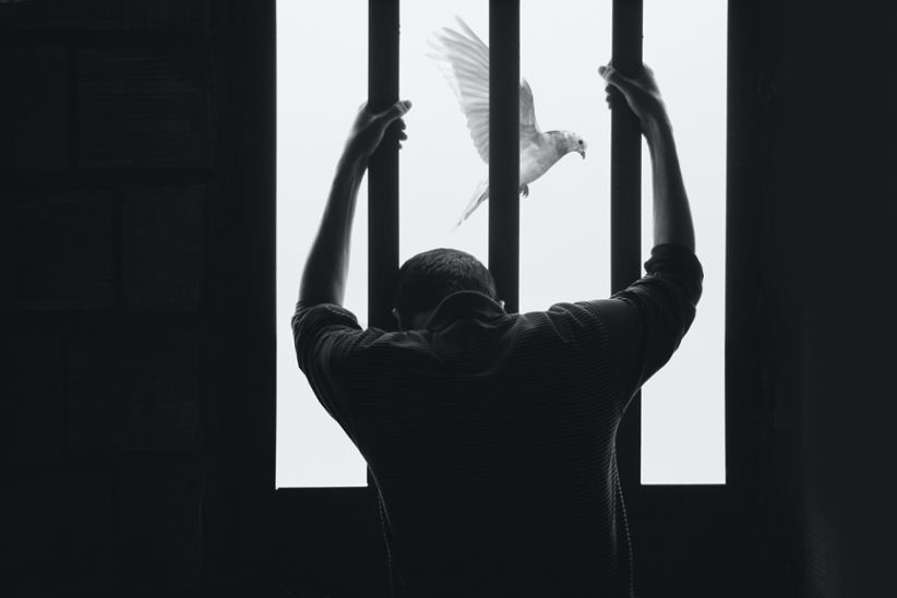 Prisoner at a window.