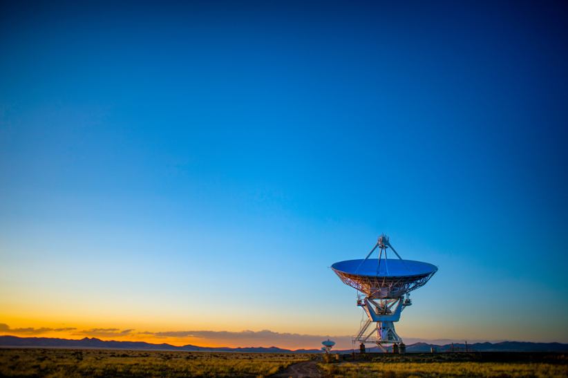 A satelitte dish pointing to the skies.