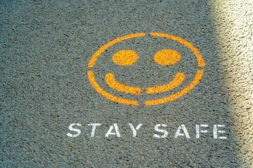 A Stay Safe sign on the ground.