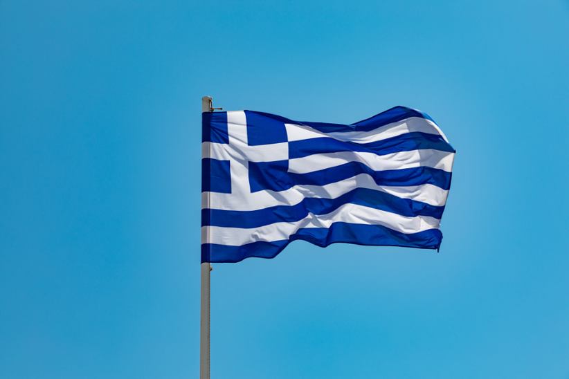 The Greek national flag waving in the wind.