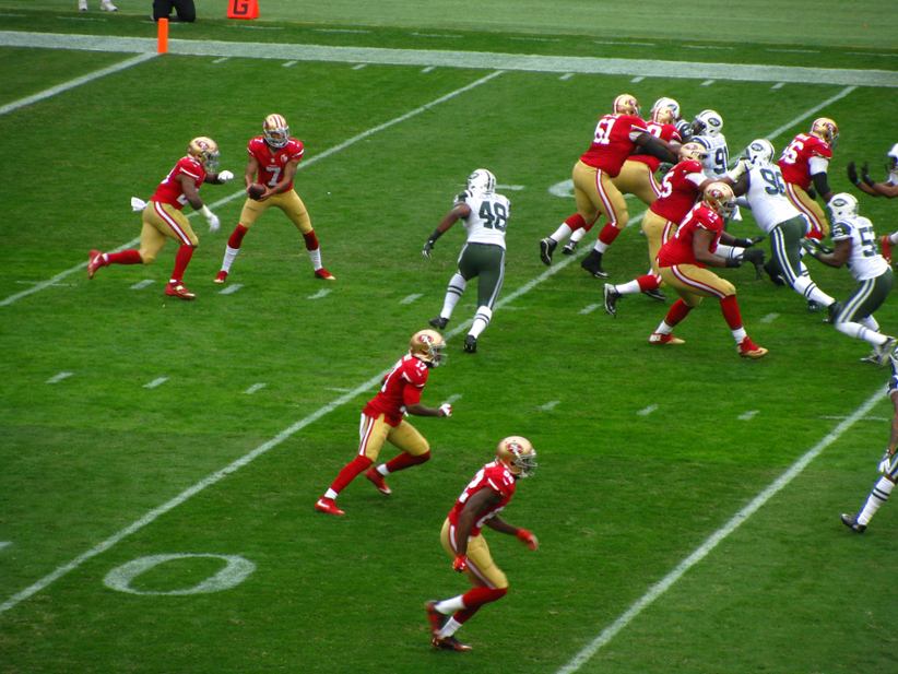 A bunch of NFL players in a game.