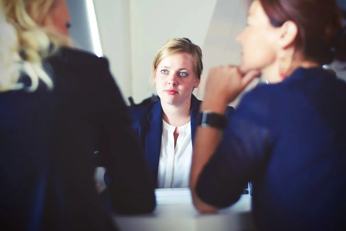 A picture of a woman who is hired in a company.