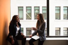 Two colleagues discussing some business.