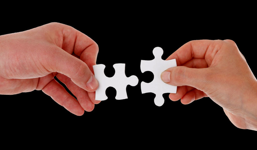 hands-joining-two-matching-puzzle-pieces