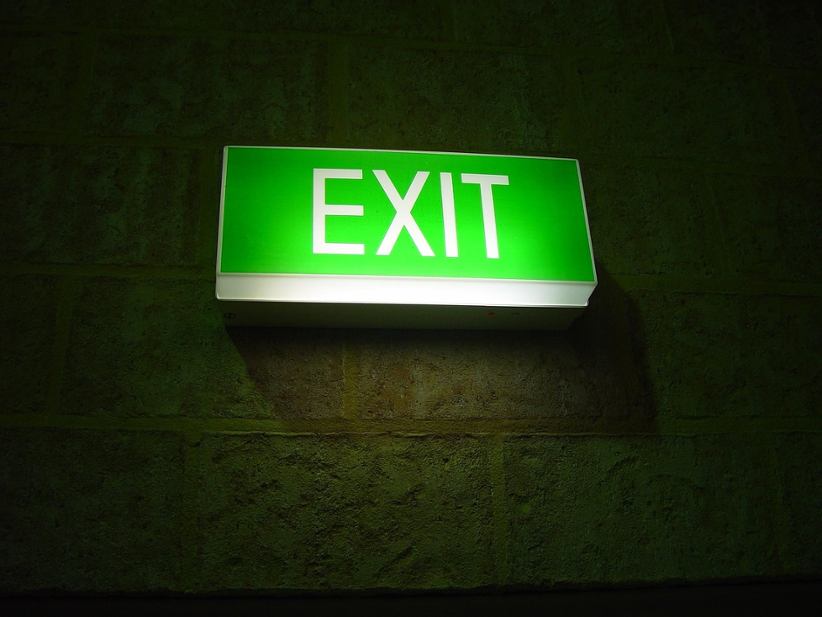 exit-sign-glowing-in-green