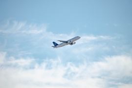 A plane taking off into the skies.