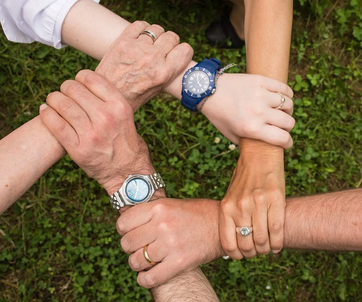 team-members-holding-hands