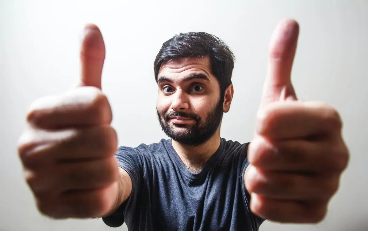 A person doing thumbs up.