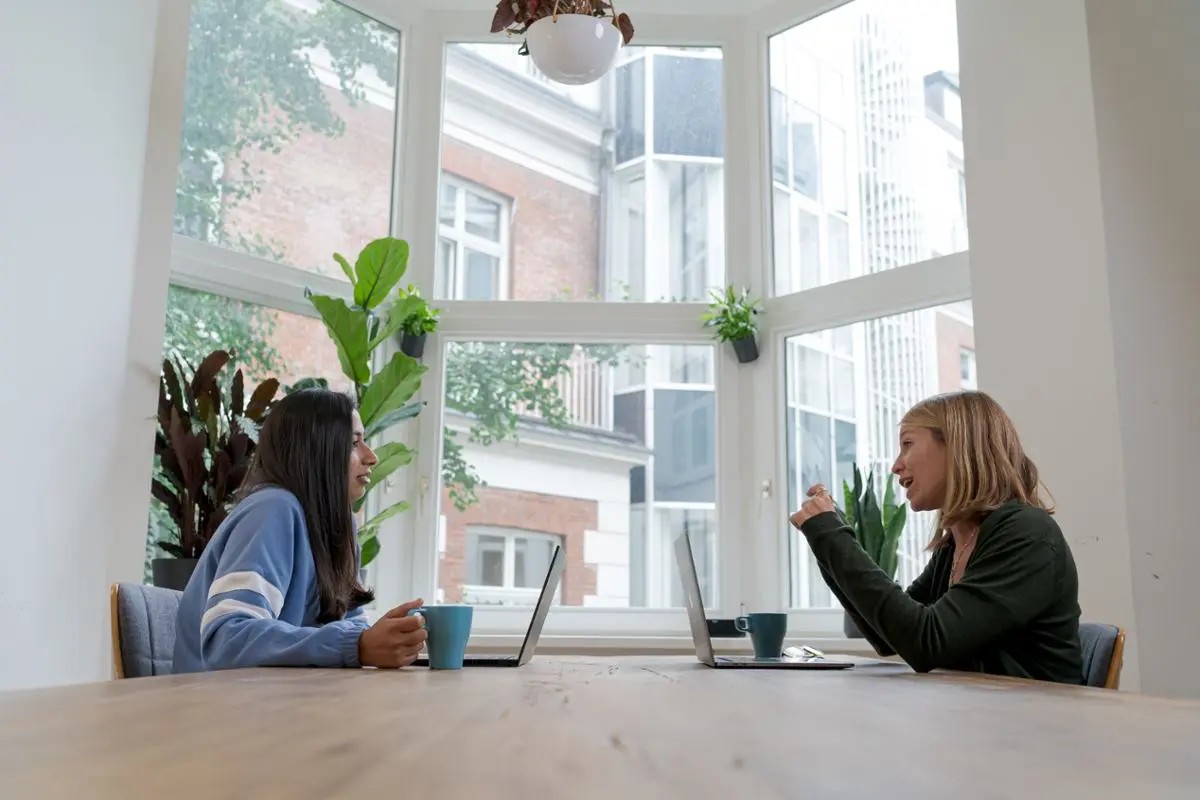 Two women discussing something.