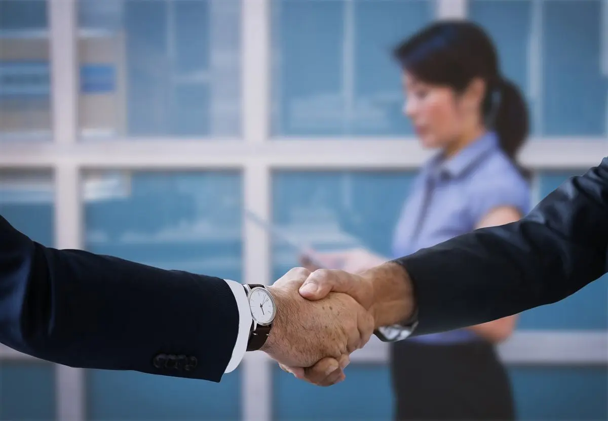 two-businessmen-shake-hands