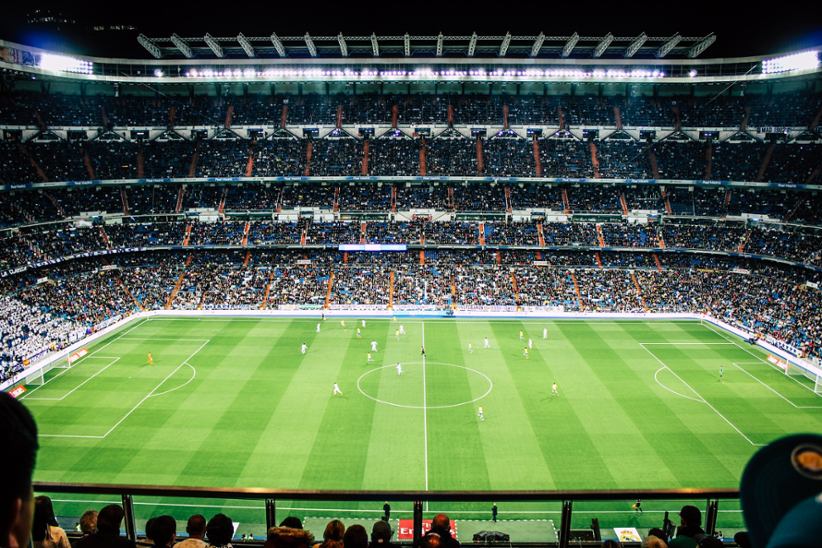 A soccer game and field.