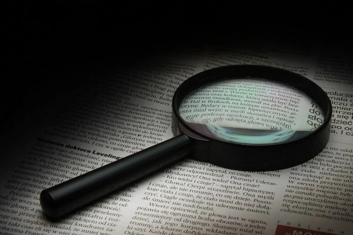 magnifying-glass-on-top-of-a-newspaper