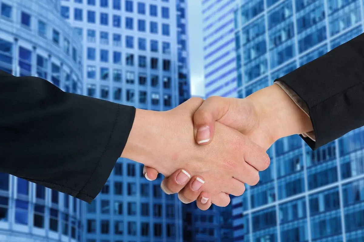 businessman-and-businesswoman-shake-hands