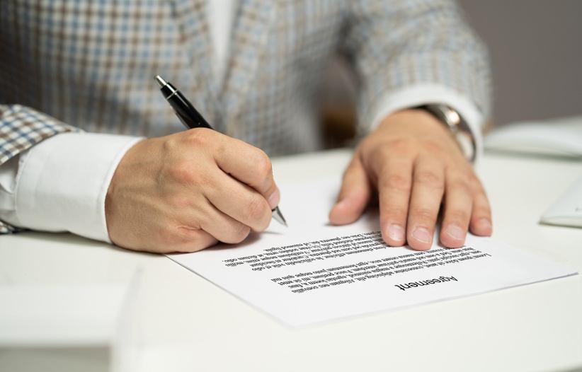 a-businessman-signing-a-document