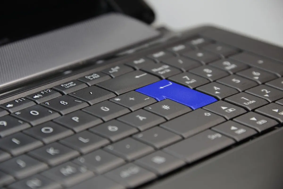 computer-keyboard-with-blue-enter-key