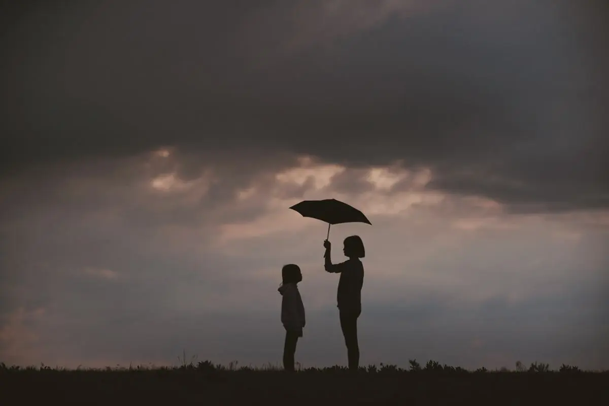 A person with an umbrella.