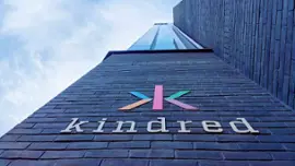 Kindred Group's logo and building.