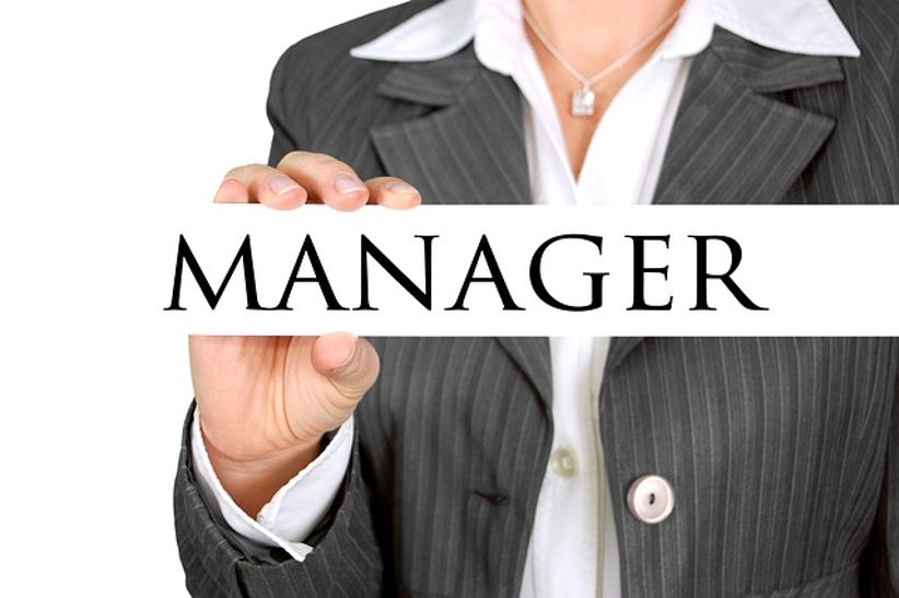 woman-holding-manager-nameplate
