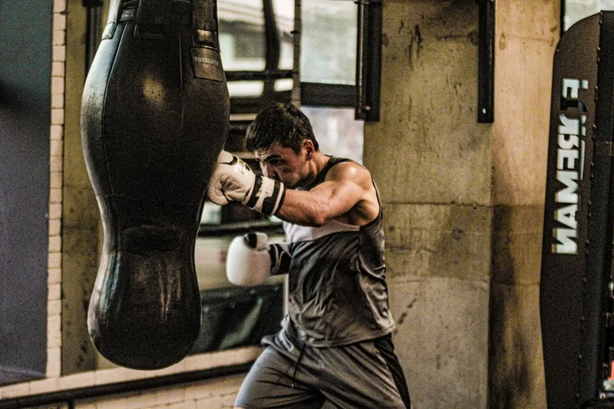 A person hitting a punchbag.