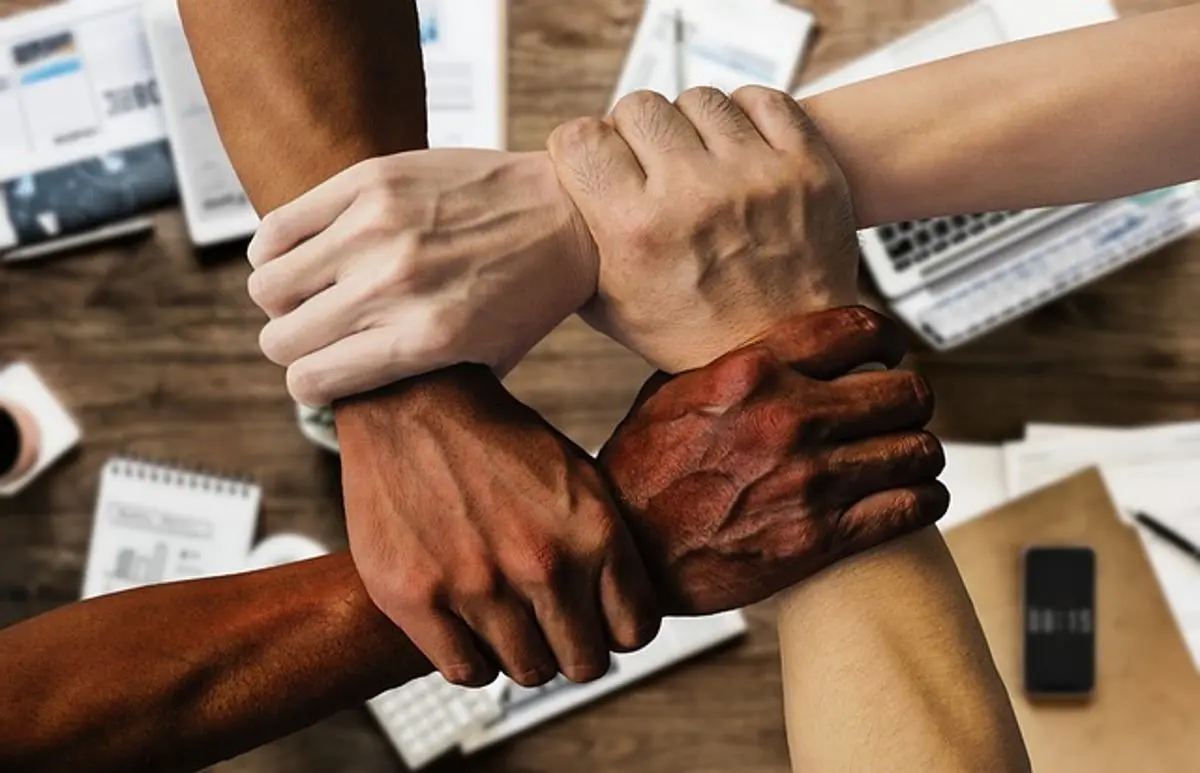 diverse-workforce-holding-hands