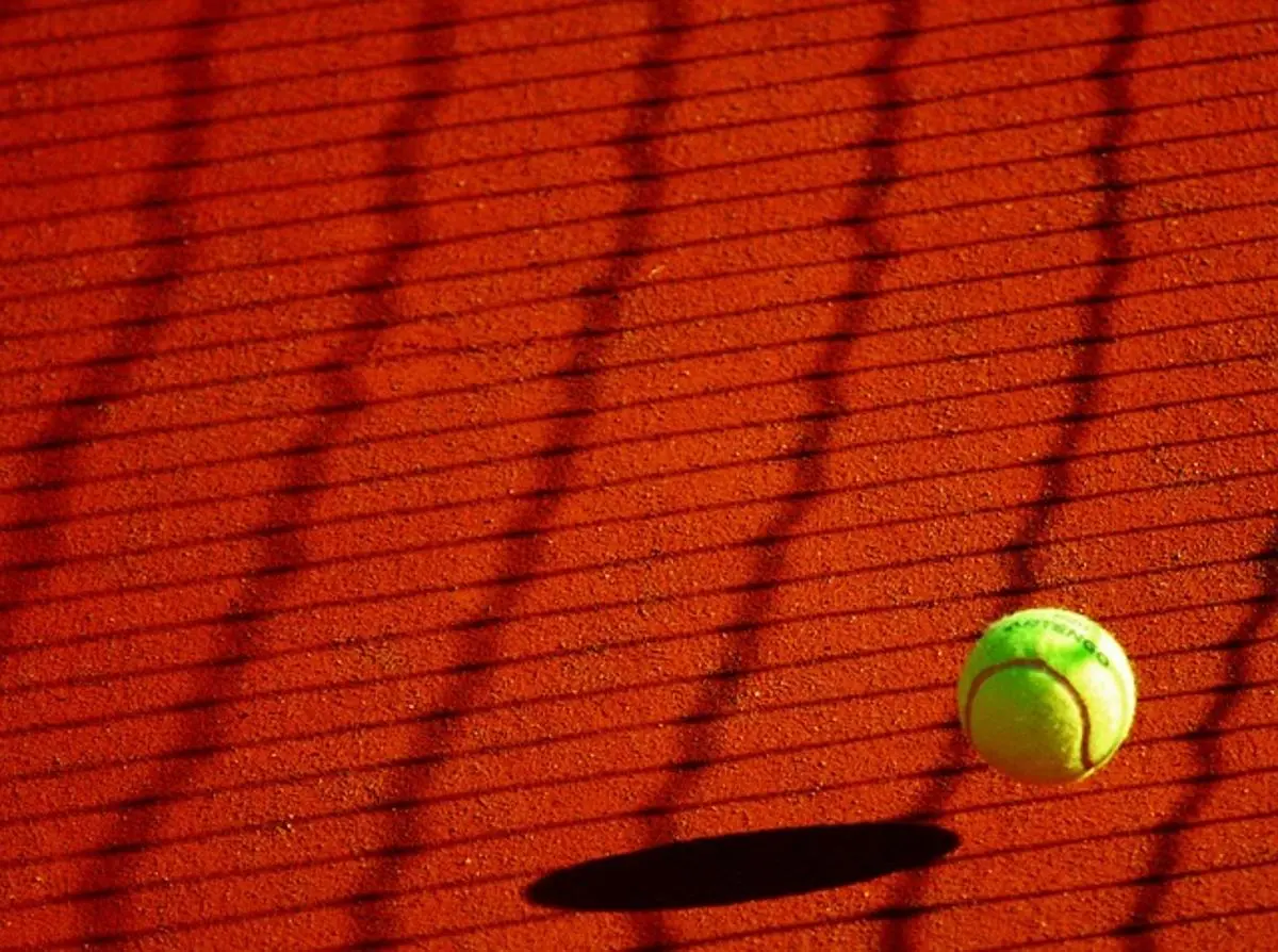 a-tennis-ball-falling-on-field