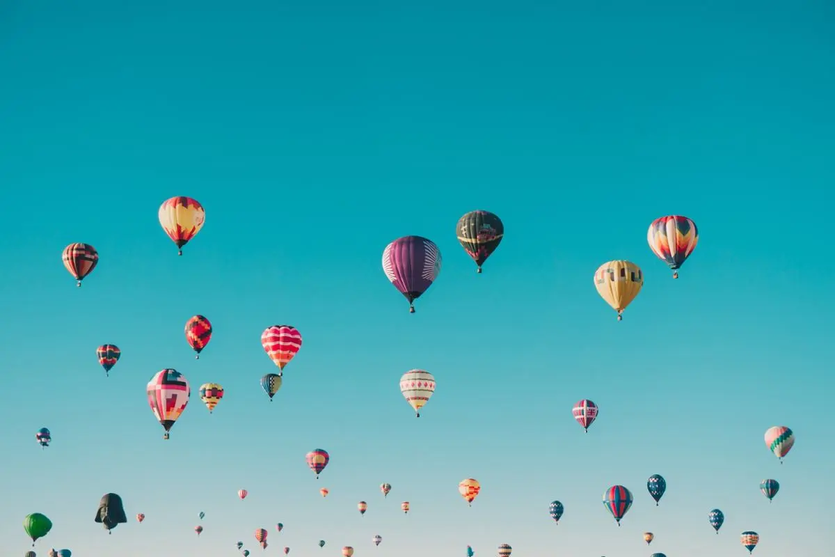 Balloons taking to the skies.