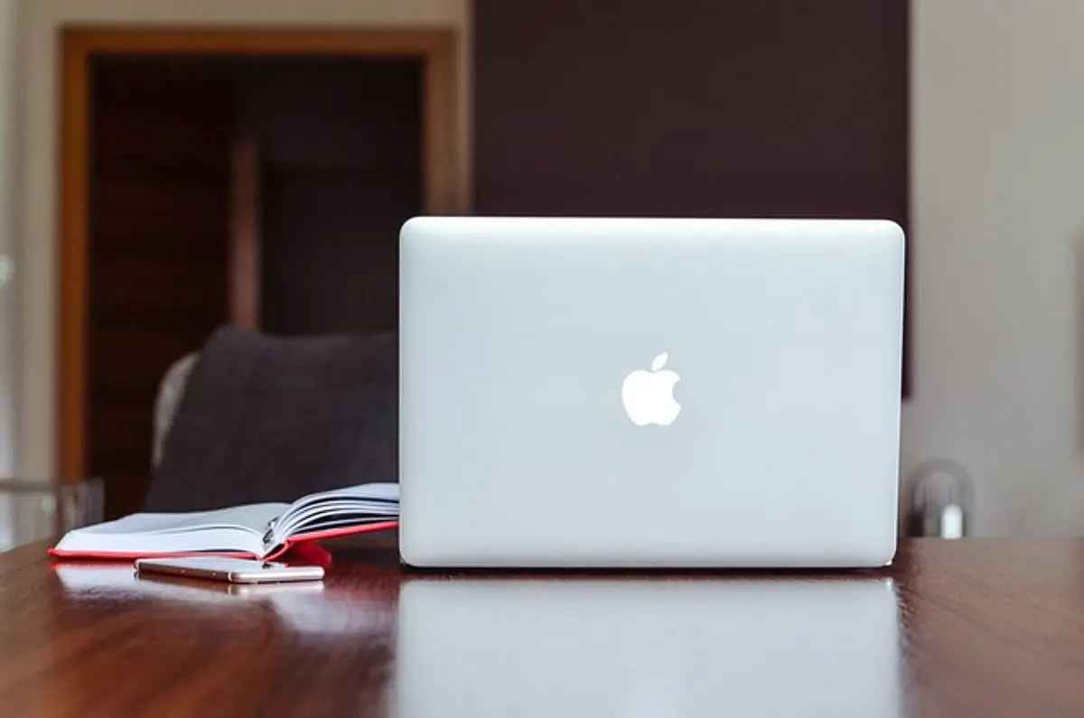 an-opened-macbook-on-a-desk-in-an-office