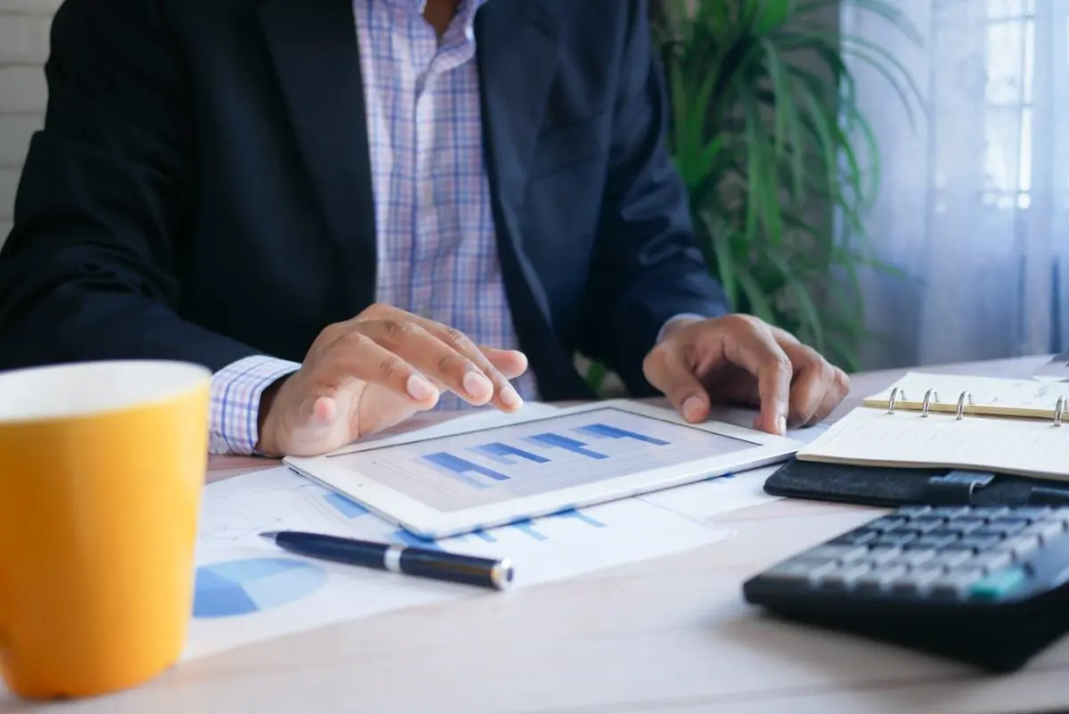 businessman-looking-at-financial-report-on-a-tablet