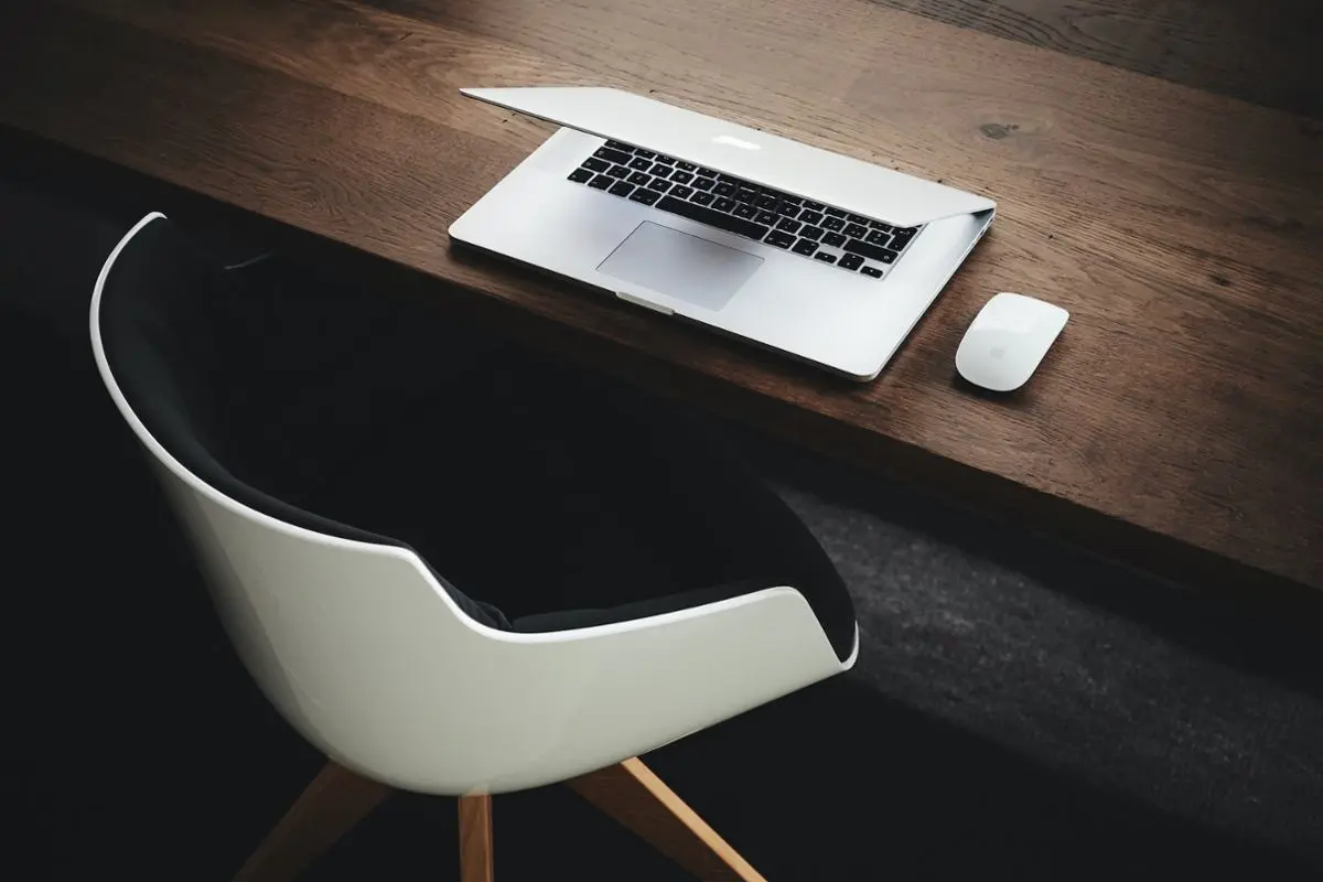 An empty desk and chair.