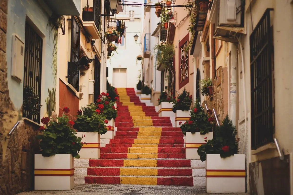 A Spanish flag painted over a staircase.