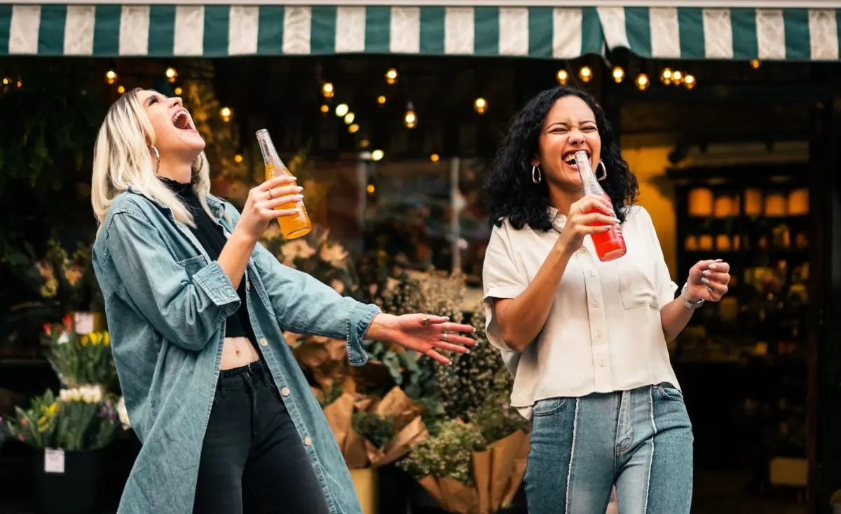 Two people cheering.