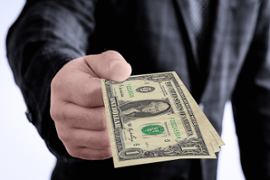 businessman-giving-one-dollar