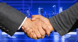 Two people shaking hands.