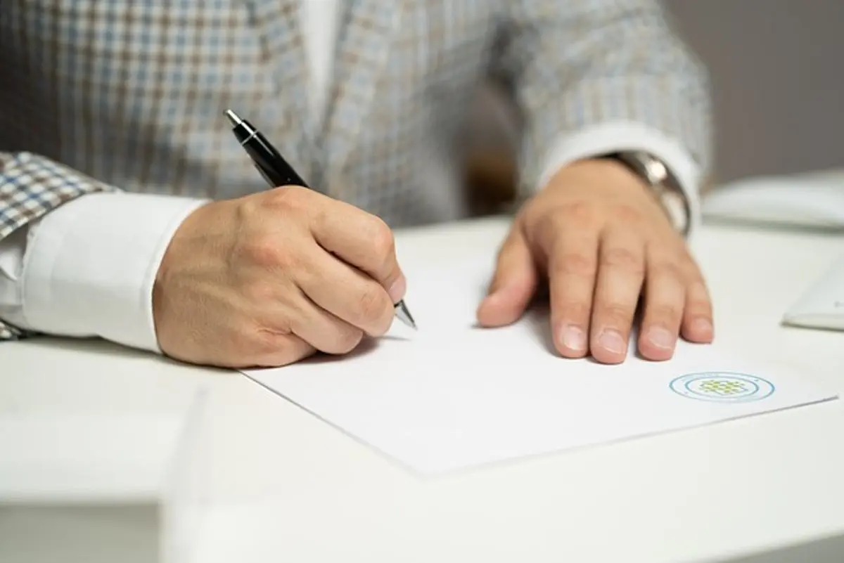 businessman-signing-a-document