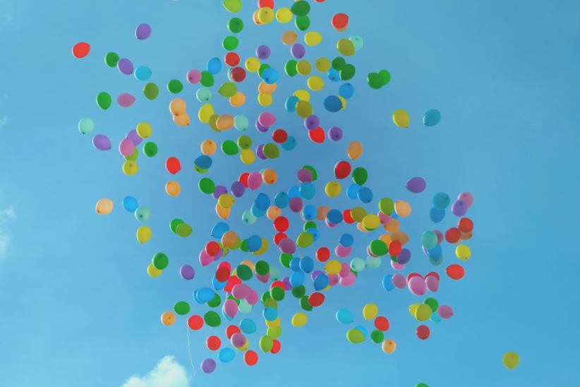Colorful balloons flying in the sky.