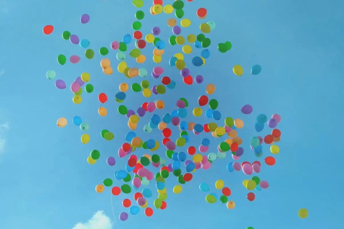 Colorful balloons flying in the sky.